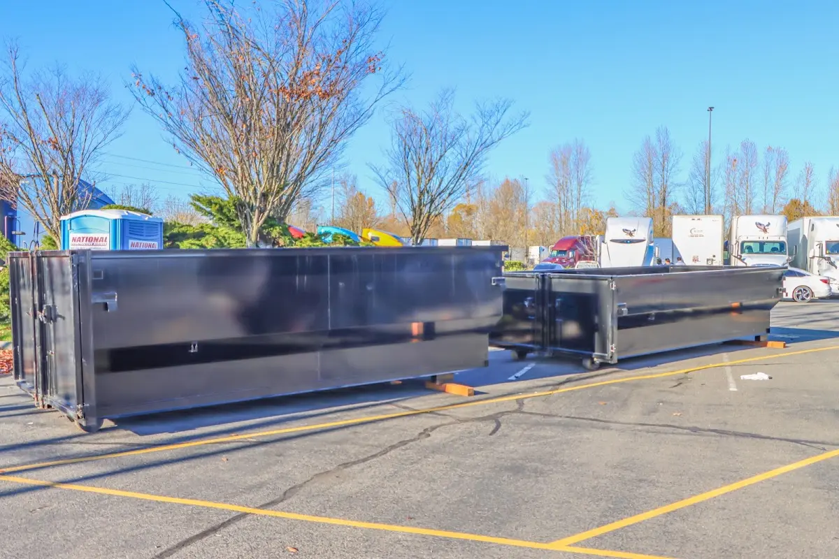 Professional dumpster rental service with roll-off container on residential driveway in Edmonds